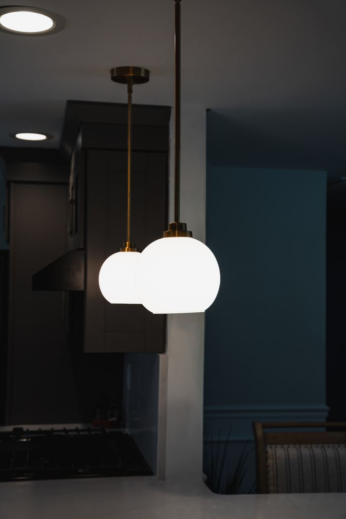 Frame: warm pendant lights over a restaurant counter